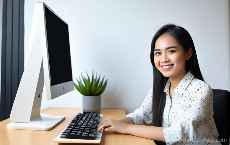 OOCSS를 통한 코드 재사용성 향상 - A cheerful young Malaysian female developer, in her late 20s, with a warm smile, sitting comfortably...